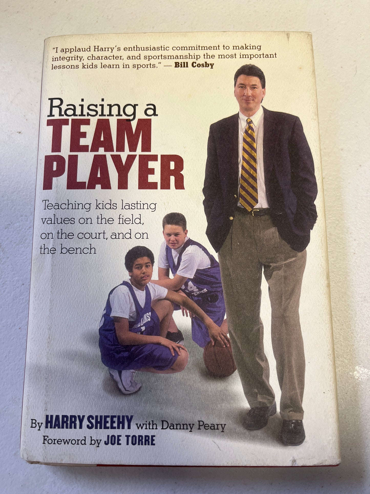 Raising a Team Player Hardcover